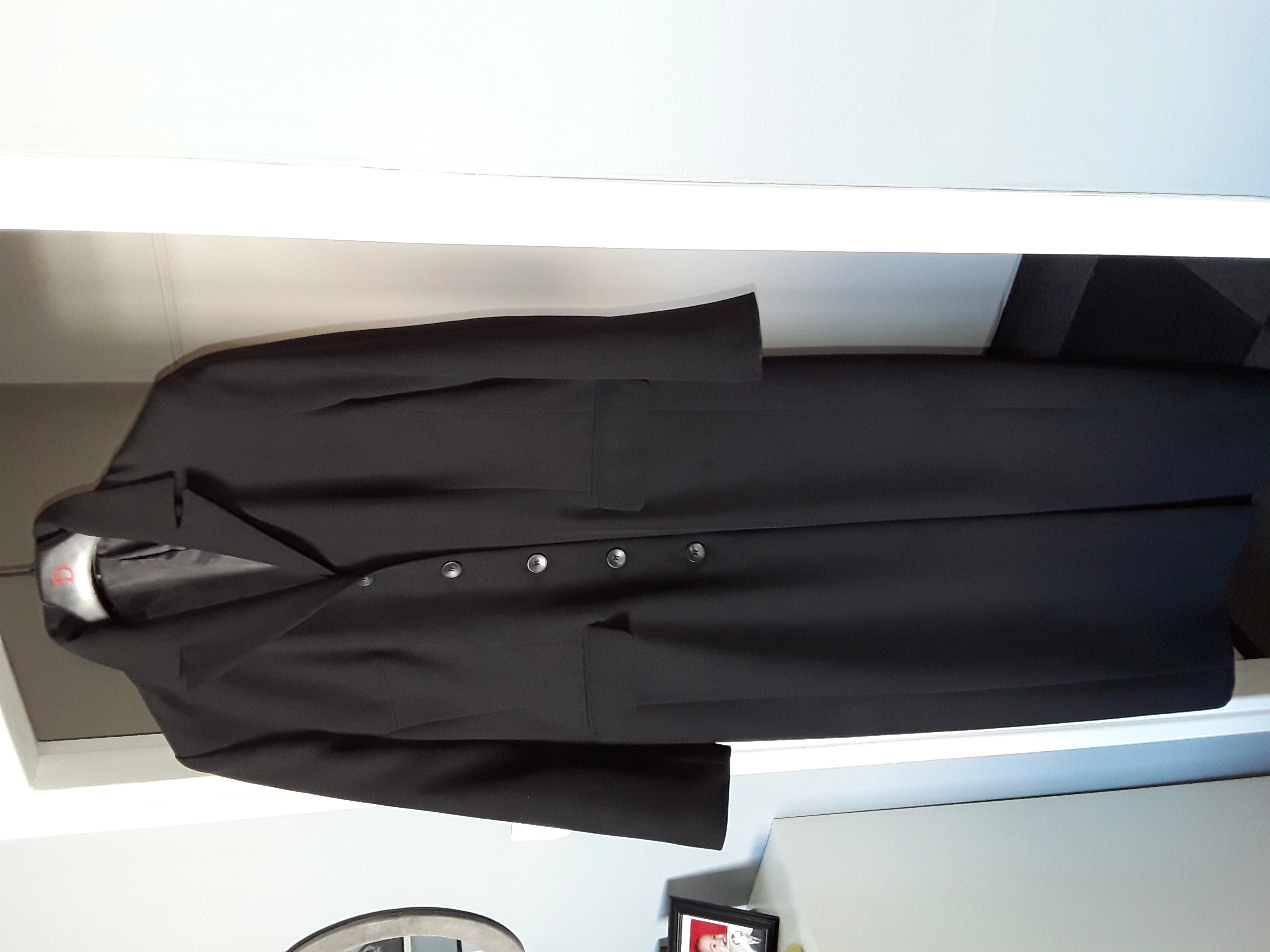 Huvudbild för Lång svart kappa, storlek 42.